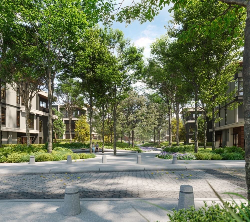 Tree-lined green spine walkway between the Parkhome rows