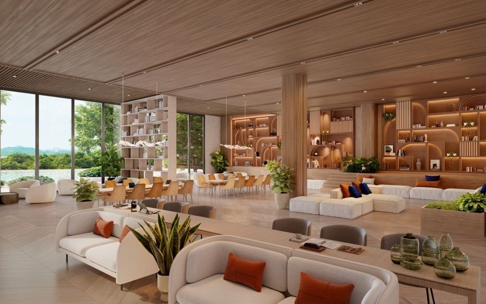 Lounge with long study tables, sofas and lit bookshelves